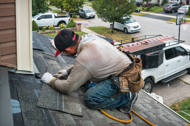 Professional Storm Damage Roof Repair technician working in Humarock, MA